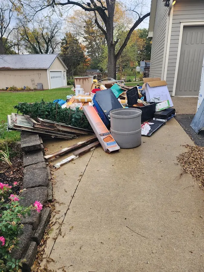 Dumpster being loaded with debris for Roofing Dumpster Rental in Shawangunk